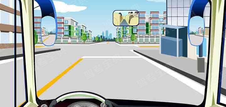 如图所示，驾驶机动车直行通过前方路口怎样行驶？